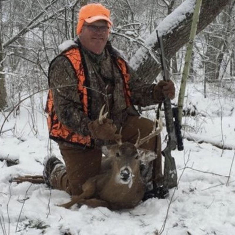 Sam Detwiler, board member and past president of the SCI East Ohio & Northwest PA Chapter, with a whitetail buck in the snow